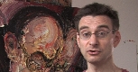 Dimitri Pavlotsky, with a painting behind him